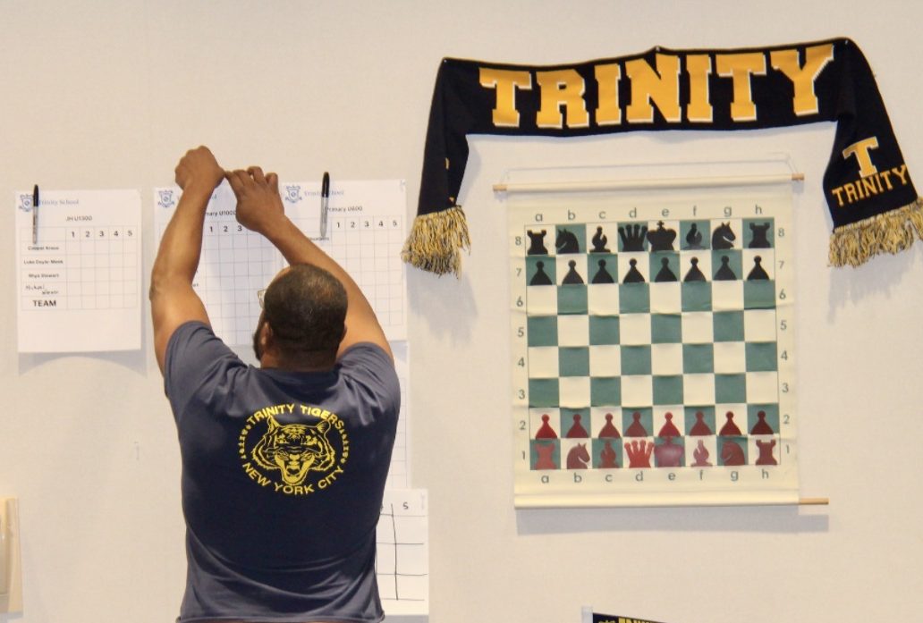School chess team posting results on the wall